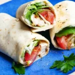 Hähnchen-Wraps mit cremiger Joghurt-Knoblauch-Sauce 4 Hähnchen-Wraps mit cremiger Joghurt-Knoblauch-Sauce